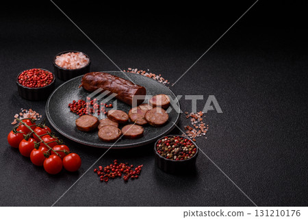 Homemade meat or vegan sausage grilled with spices. Homemade sausage cooked on barbecue 131210176