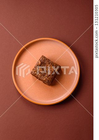 Chocolate brownie cake, food, sweet dessert with nuts rectangular shape. Sweet chocolate brownie 131210305