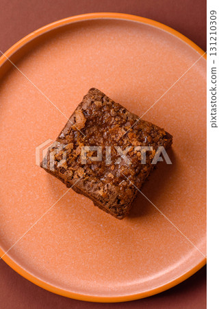 Chocolate brownie cake, food, sweet dessert with nuts rectangular shape. Sweet chocolate brownie 131210309