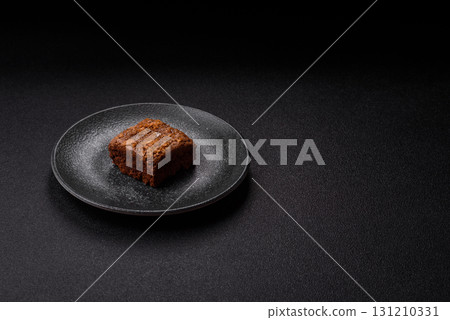 Chocolate brownie cake, food, sweet dessert with nuts rectangular shape. Sweet chocolate brownie 131210331