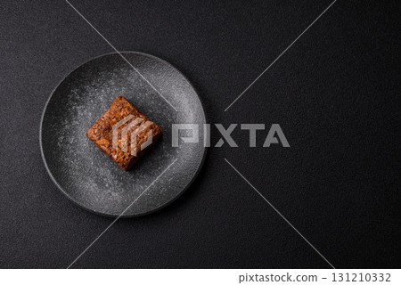 Chocolate brownie cake, food, sweet dessert with nuts rectangular shape. Sweet chocolate brownie 131210332