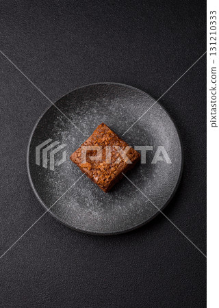 Chocolate brownie cake, food, sweet dessert with nuts rectangular shape. Sweet chocolate brownie Chocolate brownie cake, food, sweet dessert with nuts rectangular shape. Sweet chocolate brownie 131210333