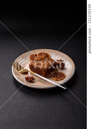 Chocolate brownie cake, food, sweet dessert with nuts rectangular shape. Sweet chocolate brownie 131210339