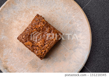 Chocolate brownie cake, food, sweet dessert with nuts rectangular shape. Sweet chocolate brownie 131210345