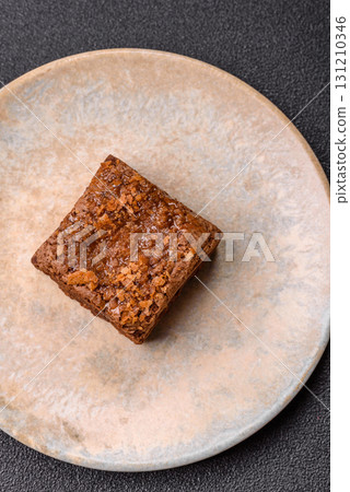 Chocolate brownie cake, food, sweet dessert with nuts rectangular shape. Sweet chocolate brownie Chocolate brownie cake, food, sweet dessert with nuts rectangular shape. Sweet chocolate brownie 131210346
