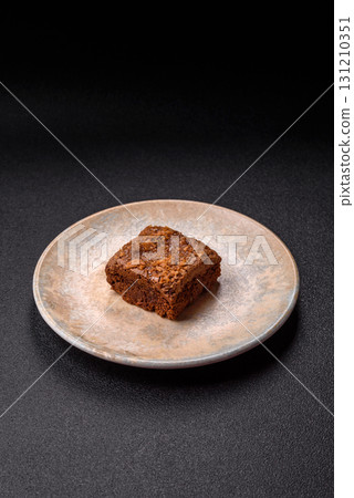 Chocolate brownie cake, food, sweet dessert with nuts rectangular shape. Sweet chocolate brownie 131210351
