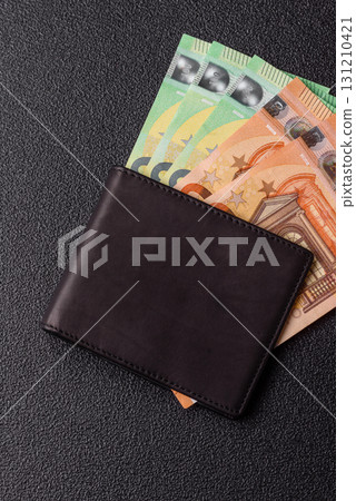 Paper money, euro notes, cash for savings and investments. Euro paper cash Paper money, euro notes, cash for savings and investments. Euro paper cash 131210421