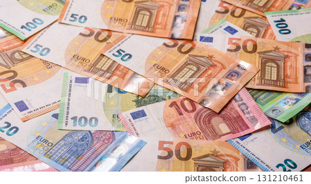 Paper money, euro notes, cash for savings and investments. Euro paper cash Paper money, euro notes, cash for savings and investments. Euro paper cash 131210461