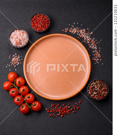 Empty ceramic plate on a monochrome brown background. Empty plate Empty ceramic plate on a monochrome brown background. Empty plate 131210631