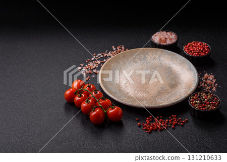 Empty ceramic plate on a monochrome brown background. Empty plate 131210633
