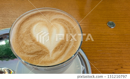 A Beautiful Heart Latte Art Presentation in a Glass Cup for Your Enjoyment and Delight A Beautiful Heart Latte Art Presentation in a Glass Cup for Your Enjoyment and Delight 131210797