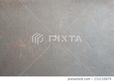 A Closeup of a Textured Surface Featuring Minimal Marks, Minor Dust Particles and Details 131210874