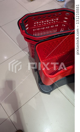 A visually appealing display of shopping baskets stacked neatly in a retail store environment 131210881