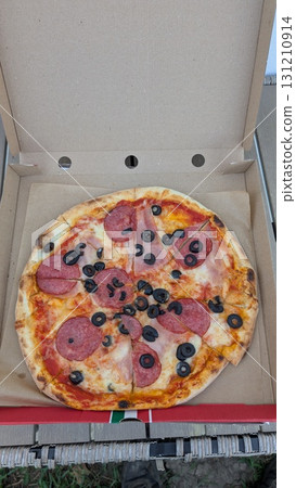 Enjoy a mouthwatering and delicious Pepperoni and Olive Pizza, beautifully packaged in a box 131210914