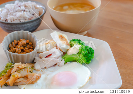Japanese breakfast of natto, fish cakes, and side dishes 131210929