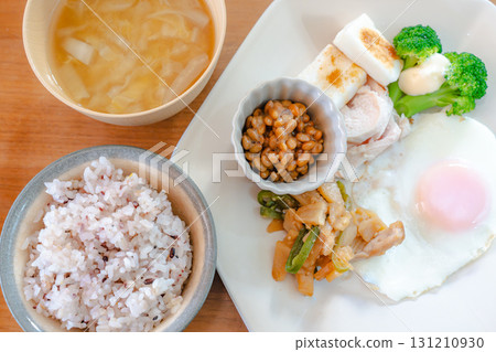 Japanese breakfast of natto, fish cakes, and side dishes 131210930