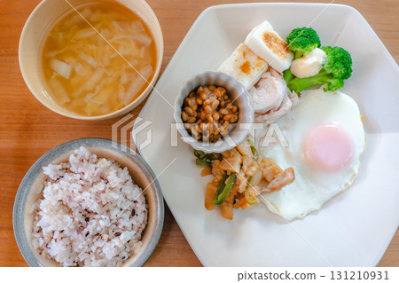 Japanese breakfast of natto, fish cakes, and side dishes 131210931