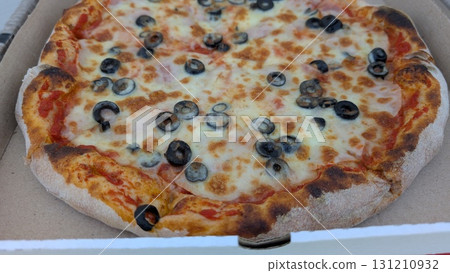 Enjoy a delicious and satisfying Pizza topped with Olives and Cheese that everyone loves 131210932