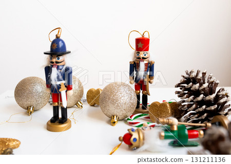 Festive nutcracker decorations with glitter ornaments and pinecones Festive nutcracker decorations with glitter ornaments and pinecones 131211136