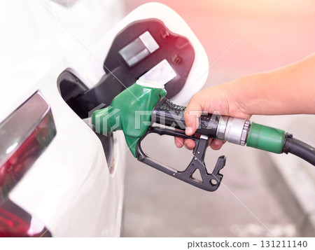 Pumping fuel at a gas station, close-up shot. 131211140