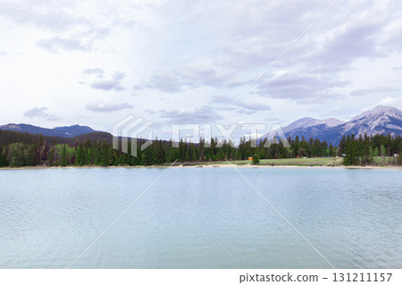 Scenic view to cyan cold waters of the mountain lake. Scenic view to cyan cold waters of the mountain lake. 131211157