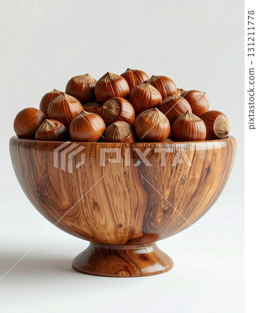 Hazelnuts Pile in Wooden Bowl Close Up Isolated on White Background Natural Warm Light Studio Shot 131211778