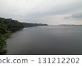Calm waters reflect overcast skies in an Amazonian river landscape 131212202