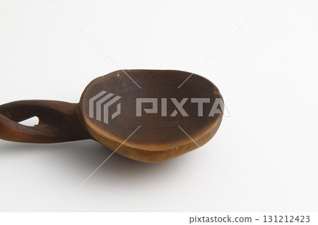 Empty spoon made of wood on white background. Top view. 131212423