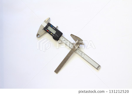 Very old used rusty iron calipers and Digital electronic vernier calipers isolated  white background 131212520
