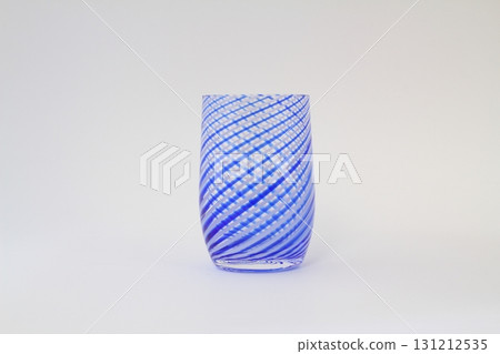 Empty blue waterglass on white background. Isolated. Backlight. Empty blue waterglass on white background. Isolated. Backlight. 131212535