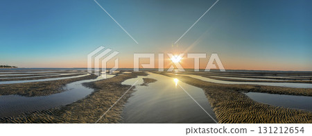 Beautiful sunset over the sandy beach of Plage Peirere in Arcachon Beautiful sunset over the sandy beach of Plage Peirere in Arcachon 131212654