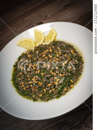 Spinach or Sabanekh with chicken a Mediterranean dish served with rice Spinach or Sabanekh with chicken a Mediterranean dish served with rice 131212660
