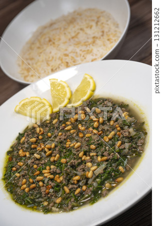 Spinach or Sabanekh with chicken a Mediterranean dish served with rice Spinach or Sabanekh with chicken a Mediterranean dish served with rice 131212662