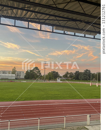 Sunset view over rugby field in Gironde during evening practice Sunset view over rugby field in Gironde during evening practice 131212761