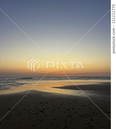 Sunset over the tranquil waters of Biscarosse beach in France 131212770