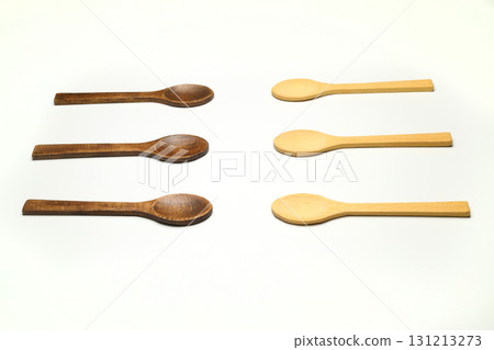 Wooden spoon on a white background. Wooden dishes. Isolate on a white background. Wooden spoon on a white background. Wooden dishes. Isolate on a white background. 131213273