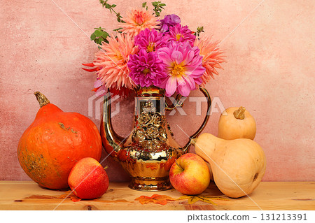 Autumn floral arrangement with dahlias in a vase, abstract still life with apples, pumpkins, and flowers, Thanksgiving holiday banner, autumn greeting. A cozy mood composition Autumn floral arrangement with dahlias in a vase, abstract still life with apples, pumpkins, and flowers, Thanksgiving holiday banner, autumn greeting. A cozy mood composition 131213391