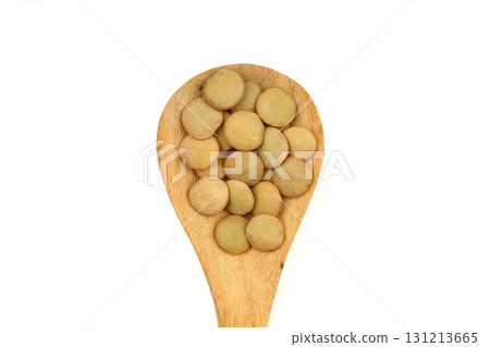 Heap of green lentils isolated on white background. Dry green lentils (Lens culinaris) close up. Top view. 131213665
