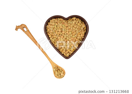 Green lentils in wooden bowl on isolated white background. Top view, copy space. Flat lay. Green lentils in wooden bowl on isolated white background. Top view, copy space. Flat lay. 131213668