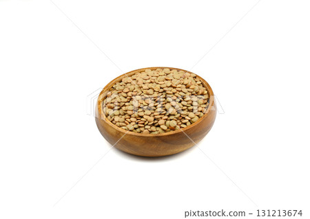 Green lentils in wooden bowl on isolated white background. Top view, copy space. Flat lay. 131213674