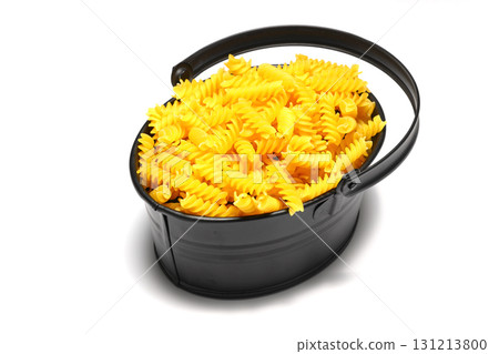 pile of spiral pasta scattered on light background pile of spiral pasta scattered on light background 131213800