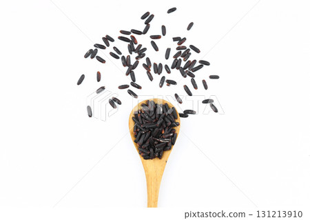 Black wild rice with bamboo spoon isolated on white background 131213910