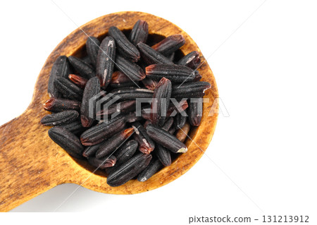 Black wild rice with bamboo spoon isolated on white background 131213912