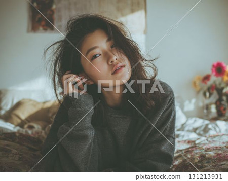 Portrait of a woman relaxing in bed Portrait of a woman relaxing in bed 131213931