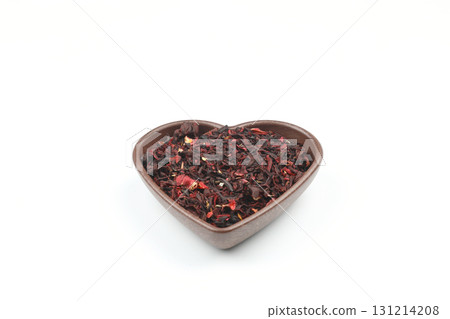 Karkade tea. Hibiscus tea leaves in wooden bowl isolated on white background. File contains clipping path. Top view. 131214208