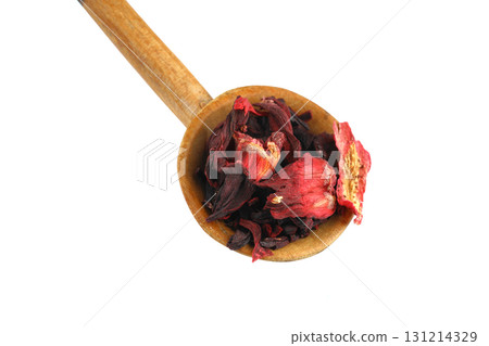 Karkade tea. Hibiscus tea leaves in wooden spoon isolated on white background. File contains clipping path. Top view. 131214329