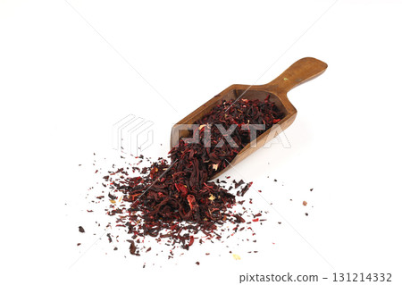 Karkade tea. Hibiscus tea leaves in wooden scoop isolated on white background. File contains clipping path. Top view. Karkade tea. Hibiscus tea leaves in wooden scoop isolated on white background. File contains clipping path. Top view. 131214332