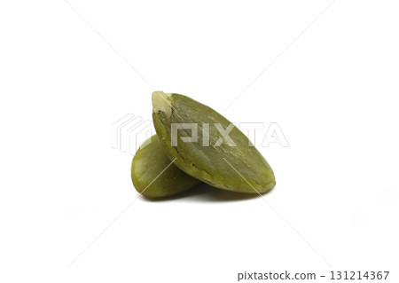 Top view of two hulled kernels of pumpkin seeds. Macro pumpkin seeds Top view of two hulled kernels of pumpkin seeds. Macro pumpkin seeds 131214367