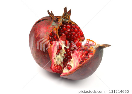 Ripe pomegranate fruit peeled on a white background top view close-up. Large open pomegranate fruit with large ripe grains isolated. Sliced exotic fruit. Ripe pomegranate fruit peeled on a white background top view close-up. Large open pomegranate fruit with large ripe grains isolated. Sliced exotic fruit. 131214660