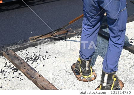 A scene of asphalt paving work on a road 131214780